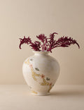#color::ivory | Bea floral motif ceramic vase by Heidi Caillier filled with red florals.