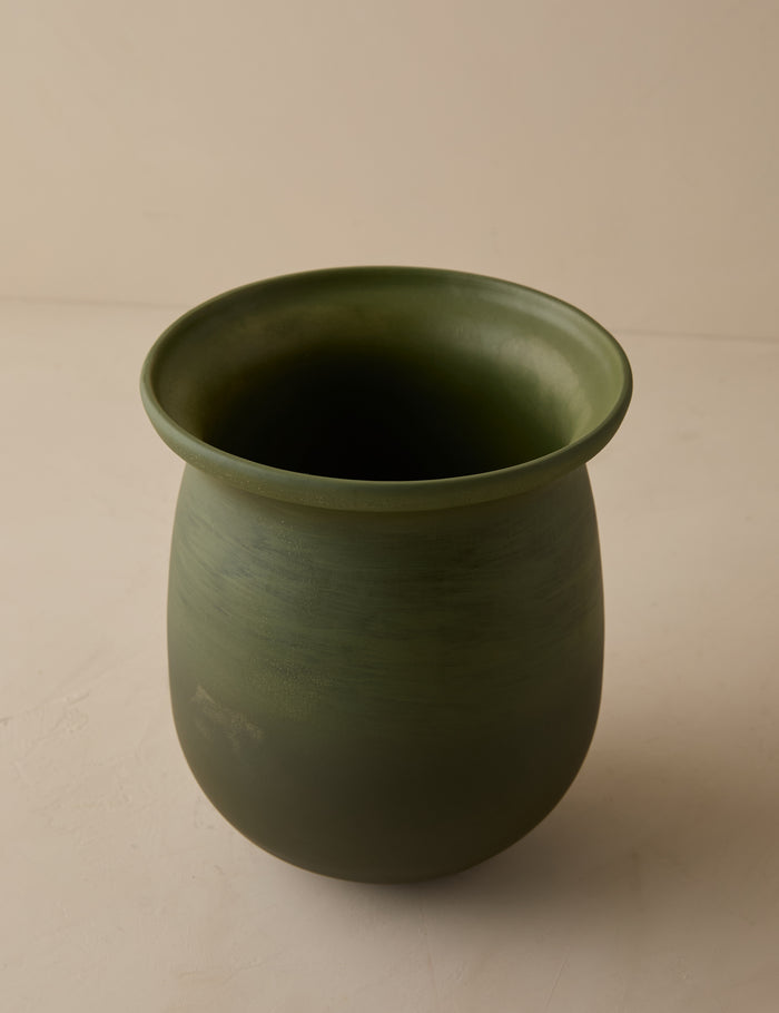 #color::olive | Angled overhead view of the Campden matte green ceramic vase by Heidi Caillier.