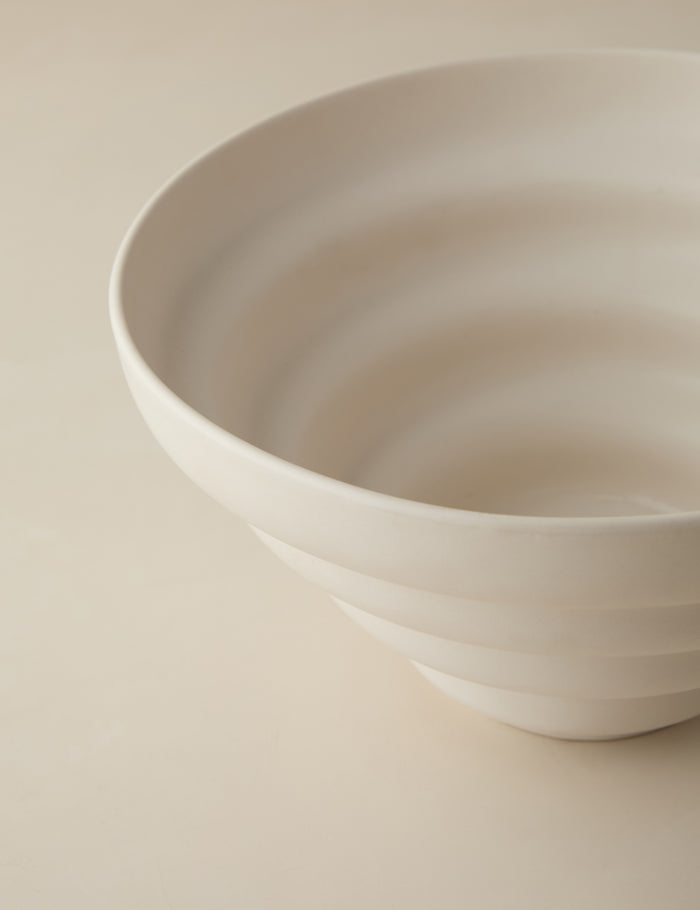 #color::ivory | Close up view of the Cascading matte ceramic serving bowl