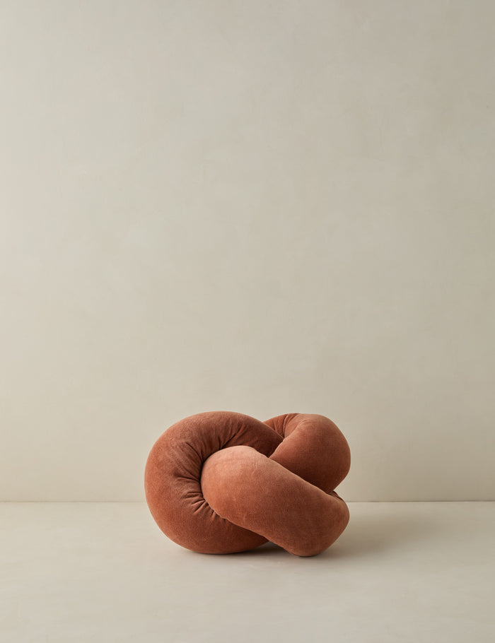 #color::burnt-orange | Dewey velvet knot ball pillow.