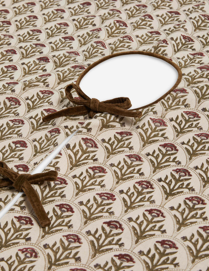 #color::red | Close up of the Dov floral pattern tree skirt