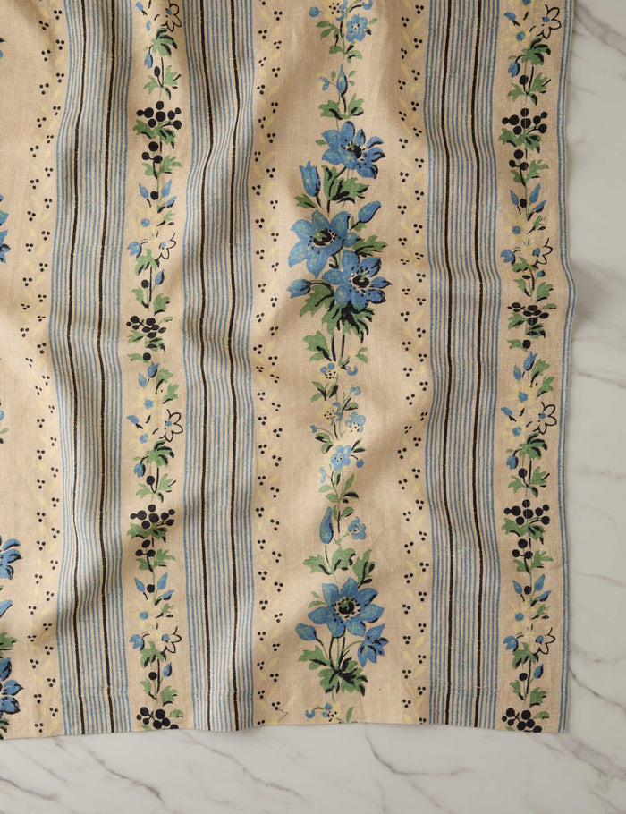 #color::azure #size::large #size::small | Close up of the Golden floral stripe linen tablecloth by Heidi Caillier
