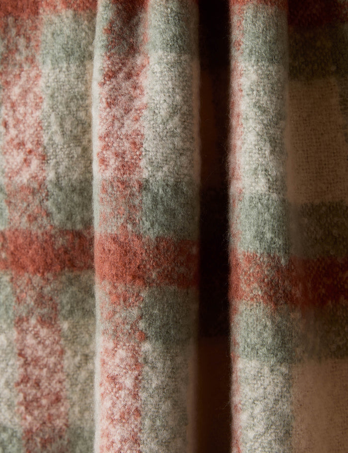 #color::sage-and-rust | Close up of the Haldar chunky tasseled edge plaid throw.