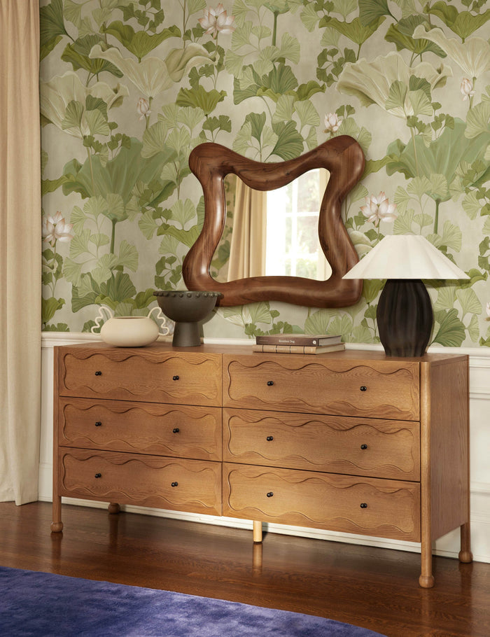 #color::green | Lotus lush botanical wallpaper by Aimee Song on a wall behind a dresser in a bedroom