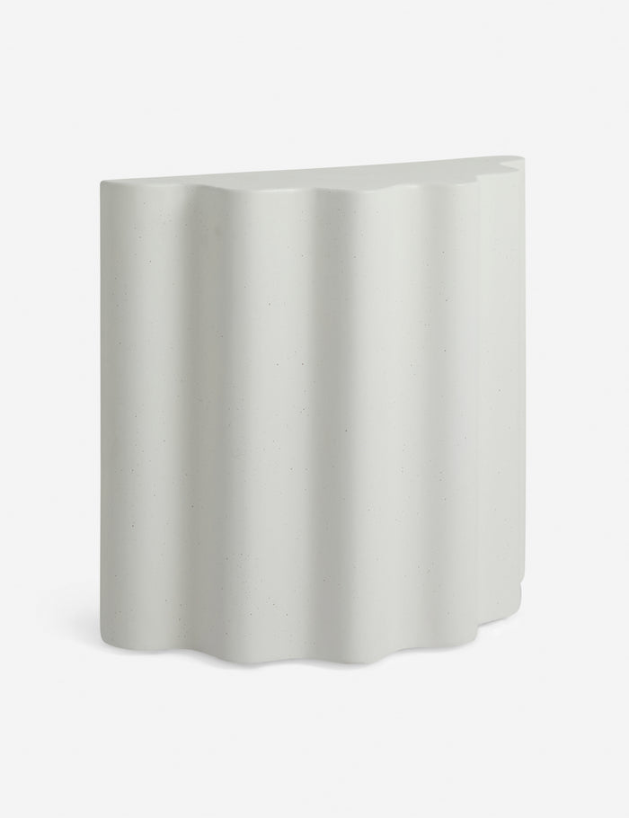#color::ivory #size::tall | Angled view of the Lune half-moon, scalloped concrete side table