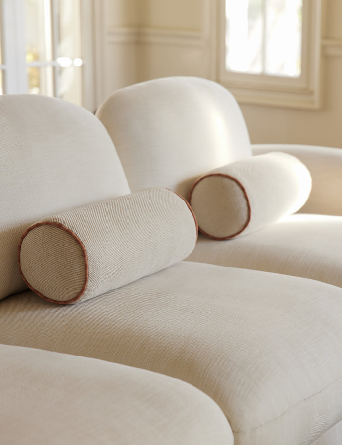 #color::natural-and-saffron | Merilee contrast piping striped bolster pillow by Aimee Song styled on a sofa