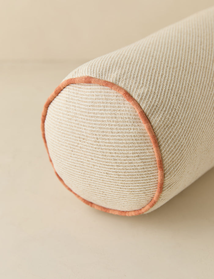 #color::natural-and-saffron | Close up view of the Merilee contrast piping striped bolster pillow by Aimee Song