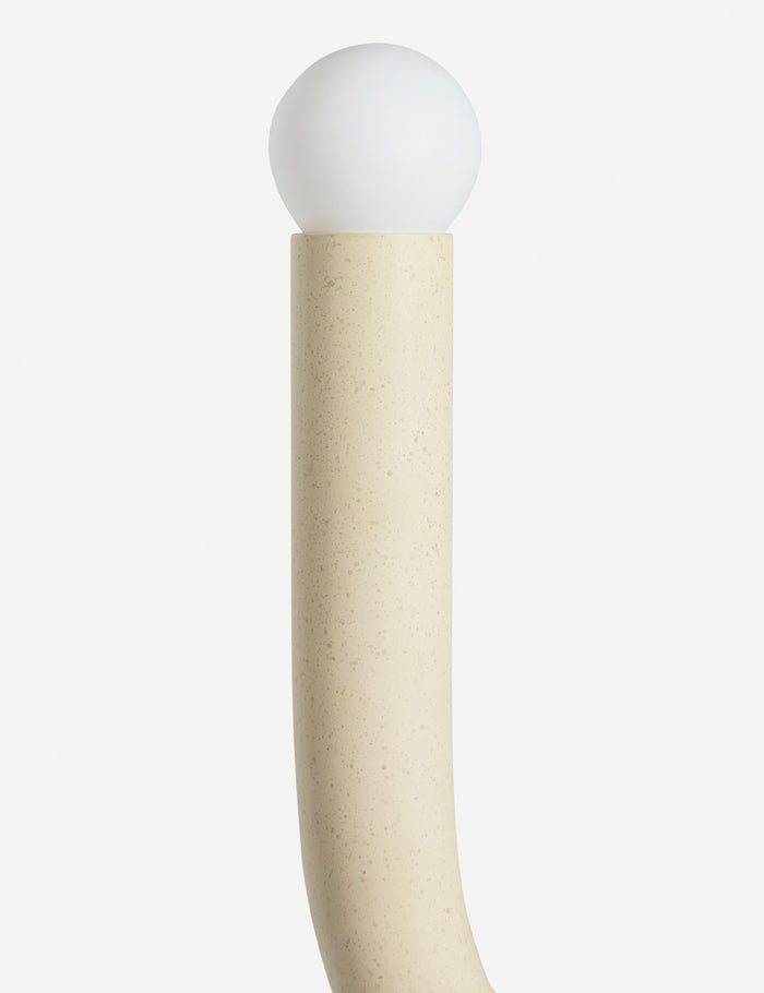 | Close up view of the Noor sculptural, wavy swing arm wall sconce