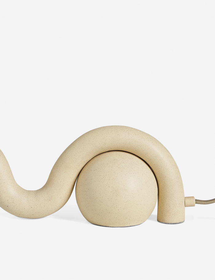 #color::sand | Close up of the Noor sculptural, wavy table lamp
