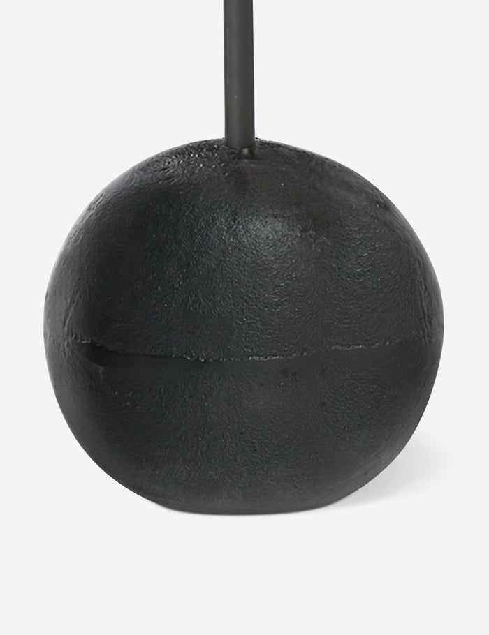 #color::black | Close up of the base of the Olinda slim, spherical base round drink table