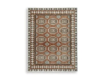 Qaabiz Area Rug