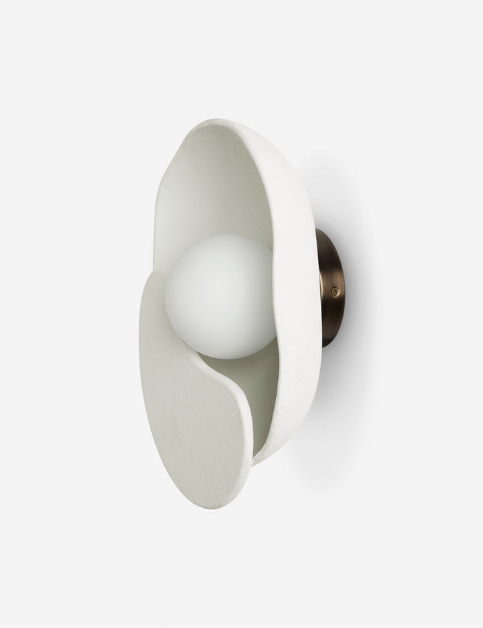 | Angled view of the Soft Petal matte white floral silhouette wall sconce light