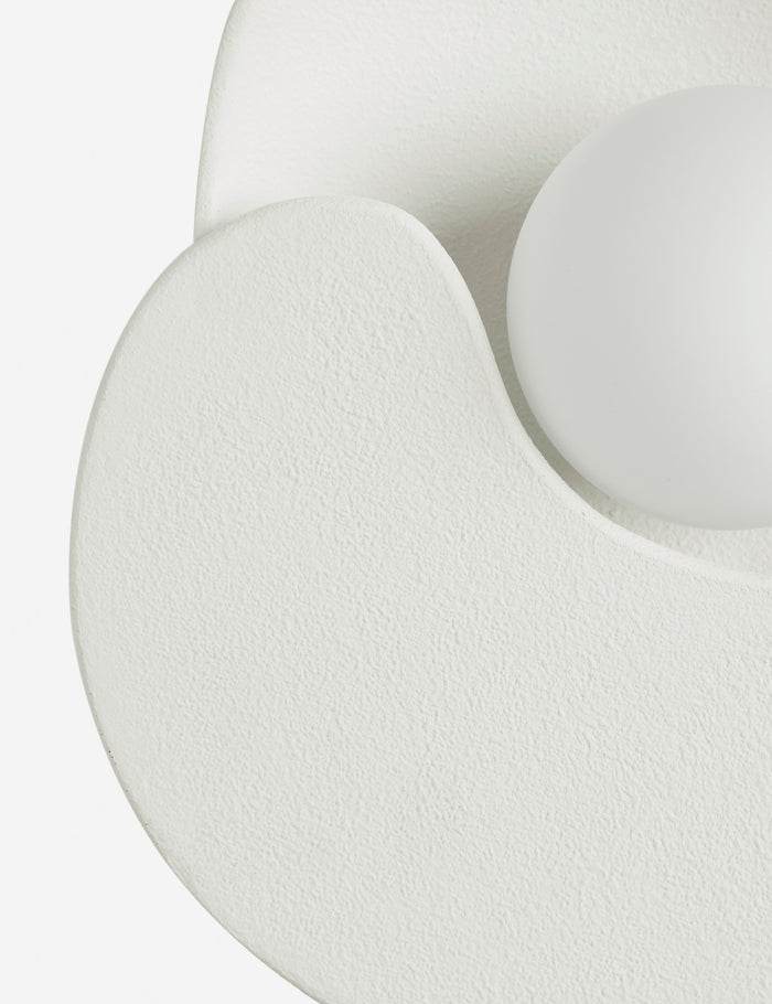 | Close up view of the Soft Petal matte white floral silhouette wall sconce light